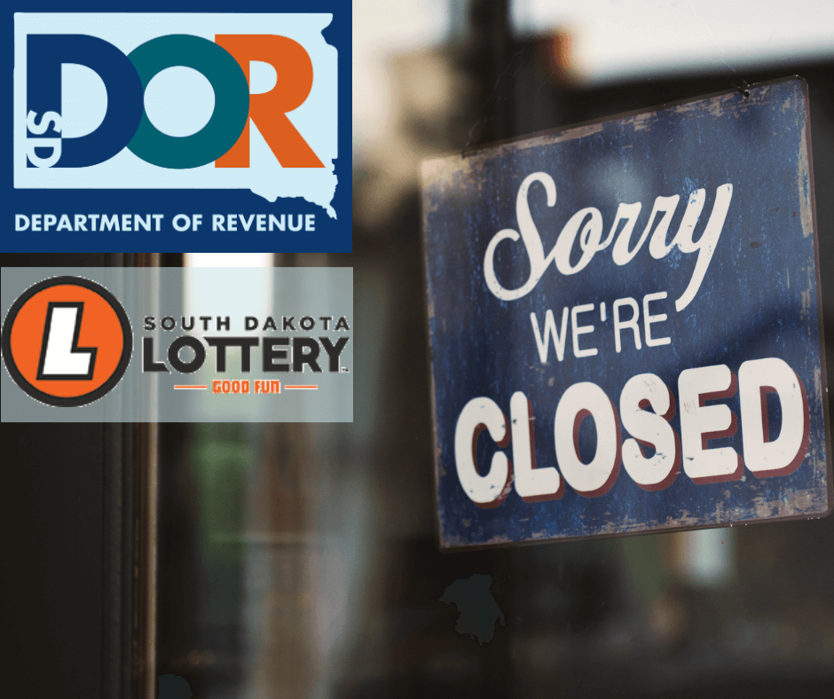 Door with a sorry we're closed sign with Department of Revenue and South Dakota Lottery logo