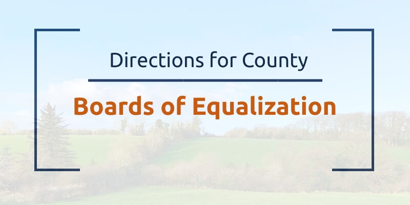 directions for County Boards of Equalization. Grassland and trees in the background
